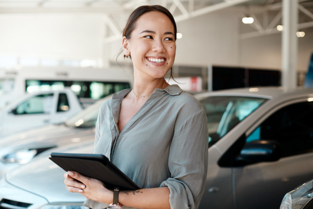 Dealership associate with tablet
